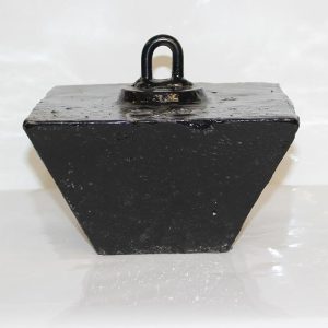 Black trapezoid-shaped metal weight with a lifting eye on top.